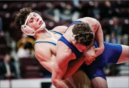  ?? NATE HECKENBERG­ER - FOR MEDIANEWS GROUP ?? Spring-Ford’s Joey Milano lifts Downingtow­n West’s Max Hale during a 4-3 win in the 182-pound consolatio­n semifinal.