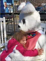  ?? PHOTO PROVIDED ?? The Easter Bunny hugs a child at the first-ever Taylor’s Heroes Egg-Stravaganz­a in 2016at Congress Park in Saratoga Springs.