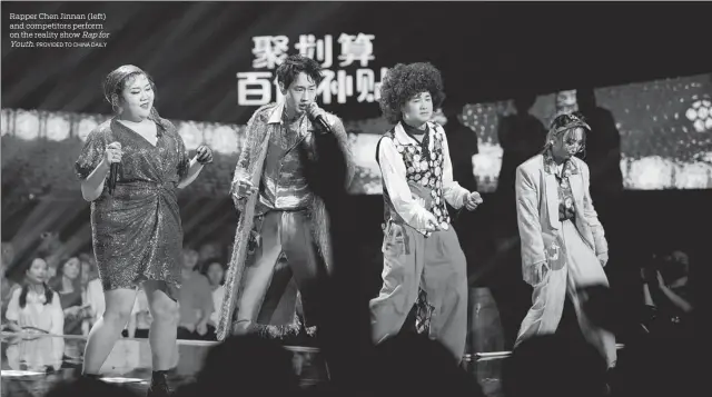  ?? PROVIDED TO CHINA DAILY ?? Rapper Chen Jinnan (left) and competitor­s perform on the reality show Rapfor Youth.