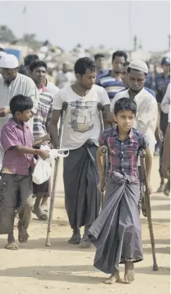  ?? PICTURE: AM AHAD/ AP ?? 0 Wounded Rohingya refugees at Kutupalong await the arrival of the UN Security Council team in the camp