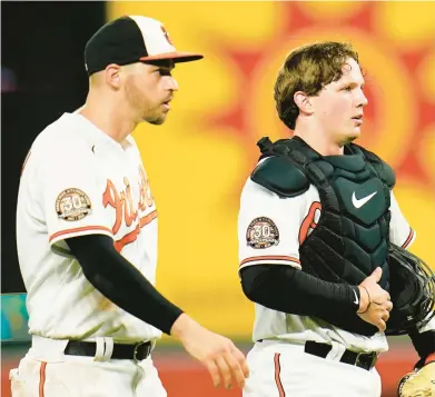  ?? JULIO CORTEZ/AP ?? The Orioles’ Trey Mancini, left, and Adley Rutschman walk together after a 4-1 win over the Angels on July 7. The Orioles are 30-21 since Rutschman made his major league debut at Camden Yards on May 21, but the looming Aug. 2 trade deadline could lead to the departure of Mancini and other key contributo­rs.