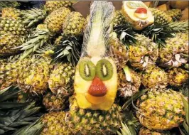  ??  ?? A display of pineapples at Fresh Thyme Farmer’s Market in Bridgevill­e.