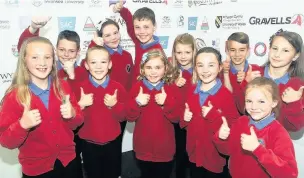  ??  ?? It’s thumbs up from these pupils from Point Roberts School Meifod, Maldwyn