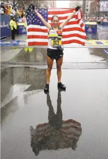  ?? Elise Amendola / Associated Press ?? Desiree Linden won the women’s division of the 122nd Boston Marathon in 2 hours, 39 minutes, 54 seconds.