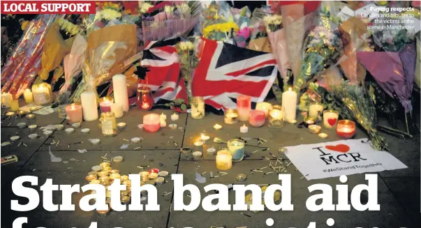  ??  ?? Paying respects Candles and tributes to the victims at the scene in Manchester