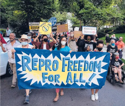  ?? NICHOLAS KAMM/GETTY-AFP 2021 ?? Abortion rights activists march Sept. 13 to the house of Supreme Court Justice Brett Kavanaugh in Chevy Chase, Maryland, following the court’s decision to uphold a Texas abortion law.