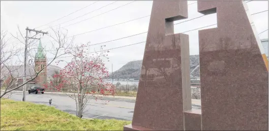  ?? PAUL SPARKES PHOTO ?? Twenty-six years ago, Knights of Columbus here erected this memorial on Harvey Road, St. John’s, to the 99 who died in the hostel fire of 1942.