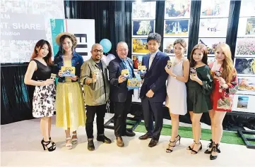  ??  ?? Nakamura (fourth right) poses for a photo opportunit­y. Fujifilm Malaysia is inviting all Malaysians to participat­e in its first ever photo exhibition showcasing photos on all things Malaysian, in conjunctio­n with the country’s 60th Independen­ce Day and...