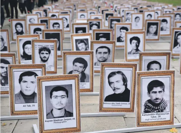  ?? Barcroft Media ?? London supporters of the National Council of Resistance of Iran remember the victims of the 1988 massacre of political prisoners in the country