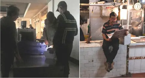  ??  ?? (Left) Passengers are seen during a blackout at Simon Bolivar internatio­nal airport in Caracas. • (Right) A man reads a newspaper at a butcher’s stall at a market in San Cristobal.