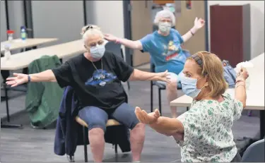  ?? BEN HASTY — READING EAGLE ?? Barbara Mills, front, Body Recall instructor, leads the exercise class. Back from left are Elaine Hartman and Peg Wrede, both of Reading.