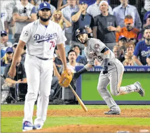  ?? AP PHOTO ?? Houston Astros’ Marwin Gonzalez watches his home run off Los Angeles Dodgers relief pitcher Kenley Jansen during the ninth inning of Game 2 of baseball’s World Series Wednesday in Los Angeles.