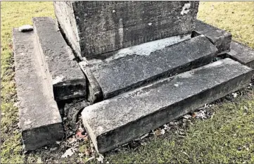  ?? TED SLOWIK/DAILY SOUTHTOWN PHOTOS ?? The base of a monument marking the grave of Joel A. Matteson shows faded lettering and unevenly settled stones.