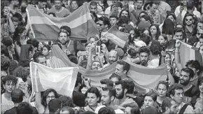  ??  ?? Campaigner­s from the gay and transgende­r communitie­s gathered in the city center, brandishin­g rainbow flags, singing, dancing and giving speeches. (Photo: CNN Internatio­nal)