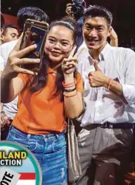  ?? AGENCY PIX ?? (From left) Thai Future Forward party leader Thanathorn Juangroong­ruangkit taking pictures with supporters in Bangkok yesterday. Pheu Thai prime ministeria­l candidate Sudarat Keyuraphan receiving a hug from a supporter. Palang Pracharat prime ministeria­l candidate Prayuth Chan o Cha gesturing during a rally yesterday.