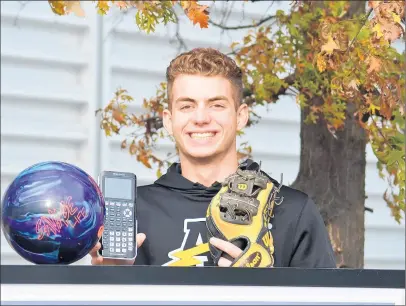  ?? JEFF VORVA/ DAILY SOUTHTOWN ?? Andrew junior Jack Day poses with a bowling ball, calculator and baseball glove. The two-sport athlete scored a perfect 800 on the math portion of the SAT.