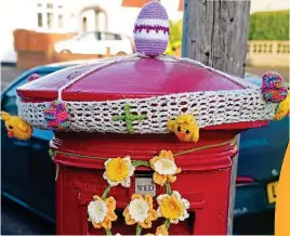  ??  ?? Egged on: This pillar box in Epsom, Surrey, combines spring and Easter with an egg, chicks and daffodils