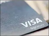  ?? ?? This file photo shows a Visa logo on a credit card in New Orleans. (AP)