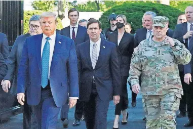  ?? [PATRICK SEMANSKY/ASSOCIATED PRESS FILE PHOTO] ?? In this June 1 photo, President Donald Trump departs the White House to visit outside St. John's Church in Washington. Walking behind Trump, from left, are Attorney General William Barr, Secretary of Defense Mark Esper and Gen. Mark Milley, chairman of the Joint Chiefs of Staff.