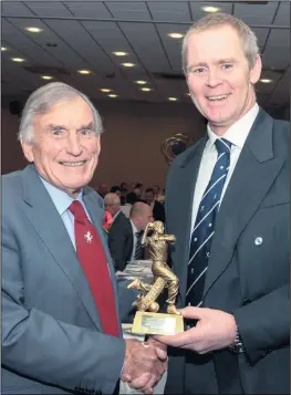  ??  ?? Chestfield’s Brian Moody-smith receives his award for being the leading wicket taker last summer in the Shepherd Neame Kent League 2nd XI, Division 4. Former Kent player Derek Ufton handed over the trophy.