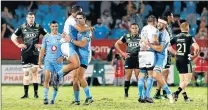  ?? Picture: AFP ?? OVERJOYED: Bulls players celebrate after their 21-19 Super Rugby victory over the visiting Hurricanes at Loftus Stadium in Pretoria on Saturday