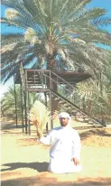  ??  ?? Awad Al Mazrouie in front of his palm tree majlis.