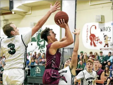  ?? STAN HUDY - SHUDY@DIGITALFIR­STMEDIA.COM ?? Stillwater junior Scott Travis looks to split the Greenwich defense of Carson Mosher (3) and Josh James (24) Tuesday night in Class C playoff action at Greenwich High Schoo. Feb. 20, 2018