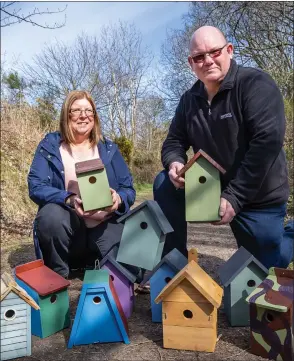  ??  ?? Jim and Pam Forbes from Tayport, who won £656,000 on the Euromillio­ns in 2017, delivering their colourful nest boxes to The Miley Wildlife Reserve in Dundee