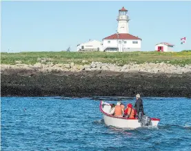  ??  ?? Visitors head to Machias Seal Island, located in the lower Bay of Fundy, approximat­ely 15 kilometres west of Grand Manan Island. Sovereignt­y of the island is disputed, with both Canada and the United States claiming ownership.