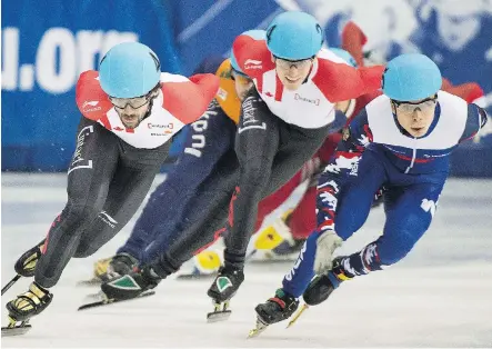  ?? GRAHAM HUGHES/ THE CANADIAN PRESS ?? Canada’s Patrick Duffy, middle, and teammate Charles Hamelin, left, will get to skate on home turf again when a World Cup short- track speedskati­ng event is held in Toronto this weekend.