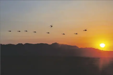  ?? U.S. MARINE CORPS PHOTO BY SGT. ALEXANDER N. STURDIVANT) ?? U.S. MARINE CORPS AH-1Z VIPERS, ASSIGNED TO MARINE AVIATION WEAPONS and Tactics Squadron One (MAWTS-1), fly to a forward arming and refueling point during WTI course 1-21, at Stoval Airfield, Dateland, Arizona, Oct. 16, 2020.