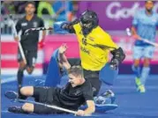  ?? AFP ?? India goalkeeper PR Sreejesh tries to foil New Zealand’s Stephen Jenness during their semifinal match. India lost 23.