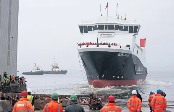  ?? ?? The Glen Sannox ferry, with windows painted on, is launched by Nicola Sturgeon, main, in a ceremony that should not have taken place, according to chairman of CalMac, formerly of CMAL, Erik Østergaard, making a rare appearance at a Holryood committee on Thursday, top