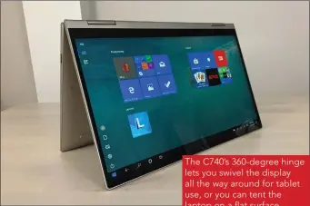  ??  ?? The C740’s 360-degree hinge lets you swivel the display all the way around for tablet use, or you can tent the laptop on a flat surface