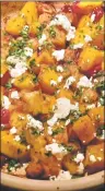  ?? LUCY HERRMAN ?? Butternut squash with cranberrie­s and feta – the author’s Greek heritage is given a nod with the addition of feta for a piquant flavor contrast.