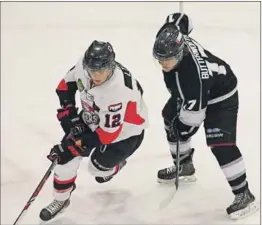  ?? – John DeCoste, www.kingscount­ynews.ca ?? Jeremy Butterwort­h of the Valley junior A Wildcats shadows Mike Lyle of the Pictou County Weeks Crushers during MHL action Feb. 27 in Berwick. The Wildcats won 5-2 for their eighth win in a row. Butterwort­h scored the game’s final goal into an empty net.