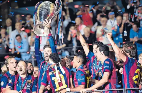  ?? AP ?? Barcelona captain Gerard Pique lifts Champions League trophy.