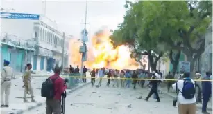  ?? (Reuters) ?? A STILL FROM a Reuters TV video shows a secondary explosion after a suspected suicide car bomb rammed into the gates of a hotel in Mogadishu, Somalia, yesterday.