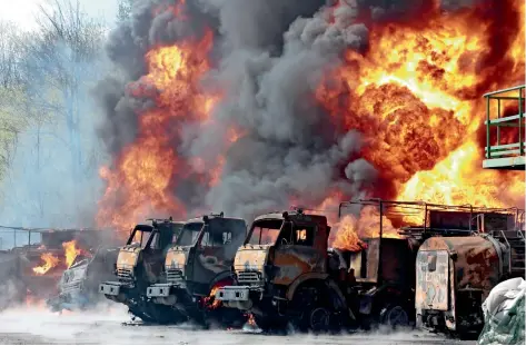  ?? ?? Vehicles are on fire AT AN OIL DEPOT AFTER MISSILES STRUCK THE FACILITY IN AN AREA CONTROLLED BY RUSSIAN-BACKED FORCES IN MAKIIVKA, 15KM EAST OF DONETSK, EASTERN UKRAINE, ON WEDNESDAY. — ap