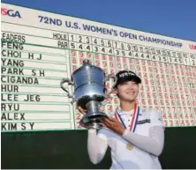  ?? Ap pHoto ?? HEAVY METAL: Sung Hyun Park holds up the championsh­ip trophy after winning the U.S. Women’s Open in Bedminster, N.J.