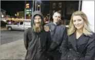  ??  ?? Elizabeth Robertson/The Philadelph­ia Inquirer via AP, File In this Nov. 17 photo, Johnny Bobbitt Jr., left, Kate McClure, right, and McClure’s boyfriend Mark D’Amico pose at a Citgo station in Philadelph­ia. When McClure ran out of gas, Bobbitt, who is...