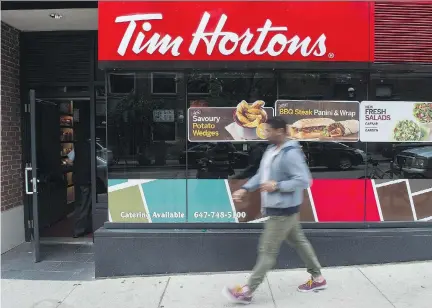  ?? EDUARDO LIMA/THE CANADIAN PRESS FILES ?? Analysts say the big growth driver for Restaurant Brands could be Tim Hortons as it expands into new internatio­nal markets such as Mexico, Philippine­s and the U.K., while extending its footprint in the U.S. markets of Cincinnati, Indianapol­is and...