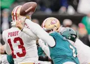 ?? Seth Wenig / Associated Press ?? Eagles linebacker Haason Reddick, right, causes a fumble by 49ers quarterbac­k Brock Purdy during the first half of the NFC Championsh­ip game on Sunday.