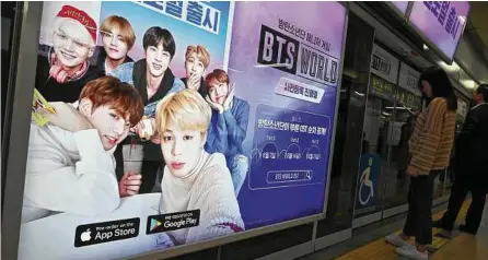  ?? Jung Yeon-Je / AFP/Getty Images ?? As BTS’s popularity grows, so does the demand for translatio­ns of the group’s songs, social media posts and interviews — and they’ve got an army of translator­s doing it for free.