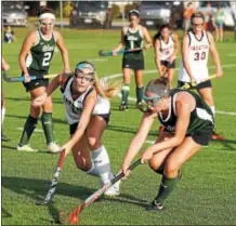  ??  ?? Saratoga Springs junior midfielder Katelyn Ginley (left) looks to knock the ball away from junior forward Jes Wolfe in the second half of Monday's game.