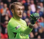  ??  ?? Goalkeeper Scott Bain, on loan from Dundee, impressed in his Celtic debut at Ibrox