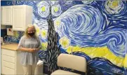  ?? Photo by Brian D. Stockman ?? Local Artist Shelly Caggiano standing in front of her Van Goth-inspired "Starry Night" mural at the pediatric center of Keystone Rural Health.