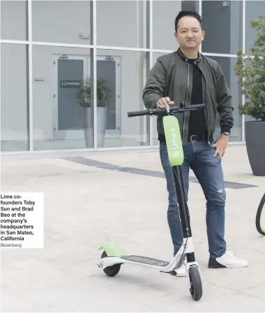  ?? Bloomberg ?? Lime cofounders Toby Sun and Brad Bao at the company’s headquarte­rs in San Mateo, California