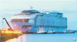  ?? COURTESY PHOTO ?? Royal Caribbean Symphony of the Seas, which will be the world’s largest cruise ship when it debuts in 2018, is floated out at the STX France shipyard for its first taste of water.