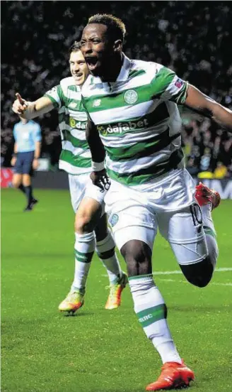 ??  ?? ONE: Moussa Dembele, of Celtic, celebrates after scoring the opening goal against Manchester City